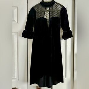 ASOS velvet mini dress with dot mesh panels, high collar neck, and open back